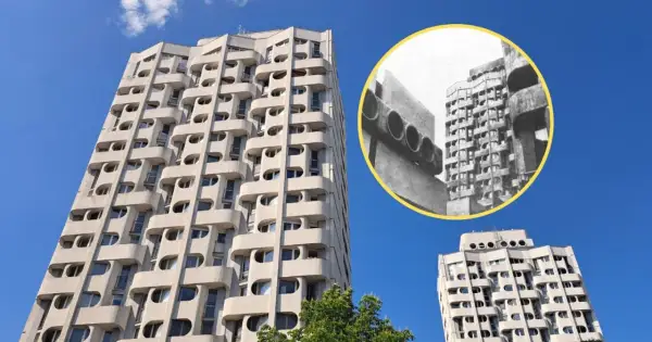 Wrocławski Manhattan: charakterystyczne bloki z lat 70. z falującymi balkonami i okrągłymi oknami, na tle błękitnego nieba.